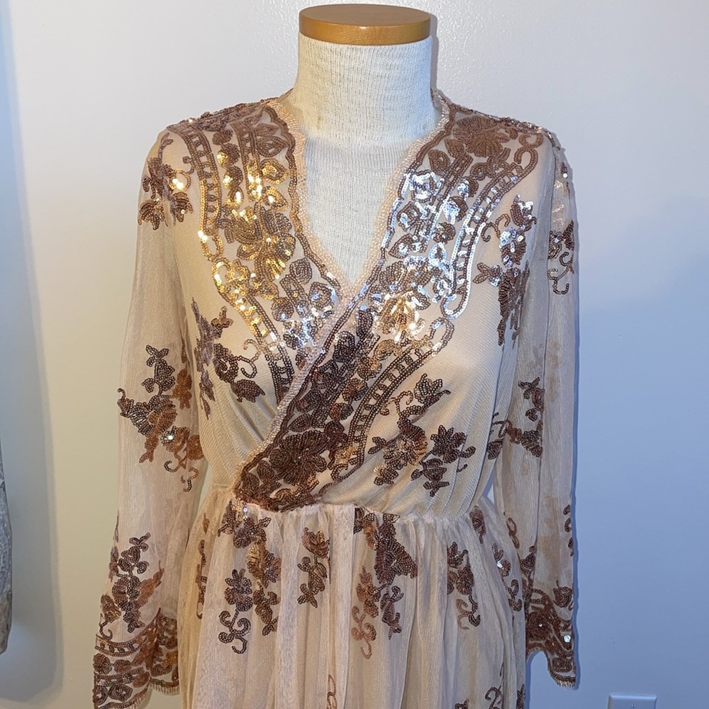 Dress size small, shiny! Color peach fabric, rose gold sequins.